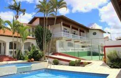 Imagem: A casa possui 3 Dormitórios, 5 Banheiros, 4 Vagas na garagem