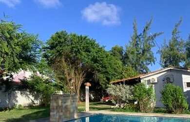 Imagem: A casa possui 4 Dormitórios, 3 Banheiros, 5 Vagas na garagem