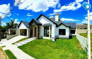 Imagem: A casa possui 3 Dormitórios, 4 Banheiros, 2 Vagas na garagem