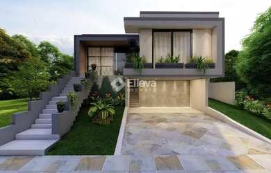 Imagem: A casa possui 3 Dormitórios, 2 Banheiros, 2 Vagas na garagem