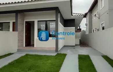 Imagem: A casa possui 3 Dormitórios, 2 Banheiros, 2 Vagas na garagem