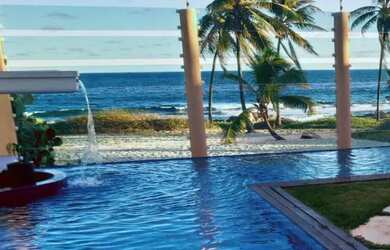 Imagem: A casa possui 4 Dormitórios e 5 Vagas na garagem e está localizado