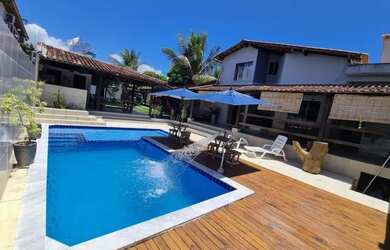 Imagem: A casa possui 3 Dormitórios e 5 Vagas na garagem e está localizado