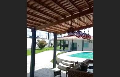 Imagem: A casa possui 3 Dormitórios, 5 Vagas na garagem e está localizado