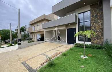 Imagem: A casa possui 3 Dormitórios, 3 Banheiros, 4 Vagas na garagem