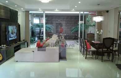 Imagem: A casa possui 3 Dormitórios, 5 Banheiros, 3 Vagas na garagem