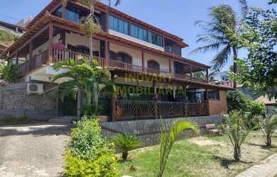 Imagem: A casa possui 5 Dormitórios, 5 Banheiros, 5 Vagas na garagem