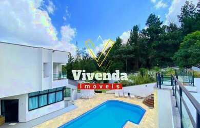 Imagem: A casa em condomínio possui 4 Dormitórios, 5 Banheiros, 5