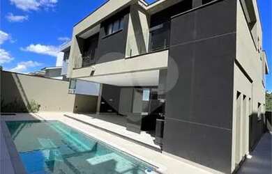 Imagem: A casa em condomínio possui 4 Dormitórios, 5 Banheiros, 4