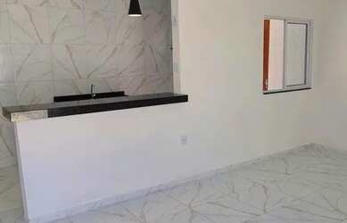 Imagem: A casa possui 2 Dormitórios, 1 Banheiro, 2 Vagas na garagem