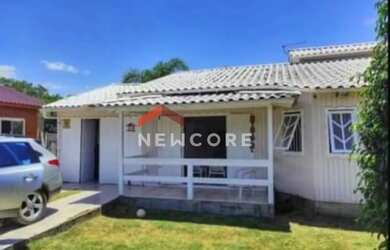 Imagem: A casa possui 3 Dormitórios, 1 Banheiro, 1 Vaga na garagem