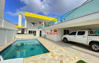 Imagem: A casa possui 5 Dormitórios, 5 Banheiros, 2 Vagas na garagem