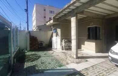 Imagem: A casa possui 3 Dormitórios, 2 Banheiros, 5 Vagas na garagem