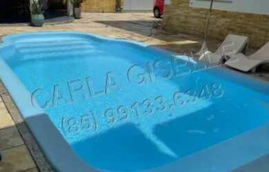 Imagem: A casa possui 4 Dormitórios e 5 Vagas na garagem e está localizado