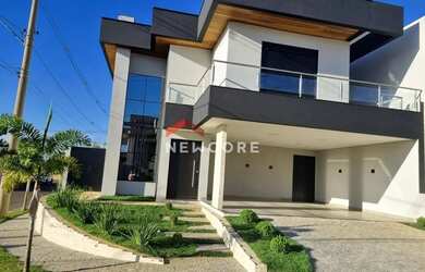 Imagem: A casa em condomínio possui 4 Dormitórios, 5 Banheiros, 252m²