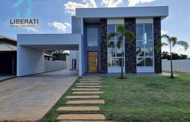 Imagem: A casa possui 4 Dormitórios, 5 Banheiros, 5 Vagas na garagem