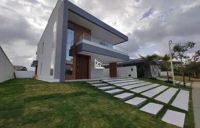 Imagem: A casa possui 5 Dormitórios, 5 Banheiros, 4 Vagas na garagem