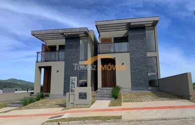 Imagem: A casa possui 2 Dormitórios, 3 Banheiros, 1 Vaga na garagem