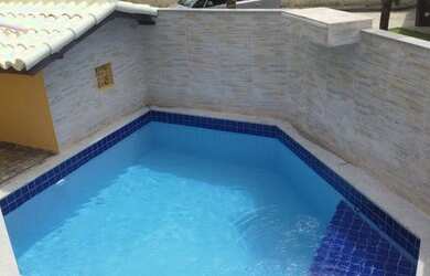 Imagem: A casa possui 4 Dormitórios e 3 Vagas na garagem e está localizado