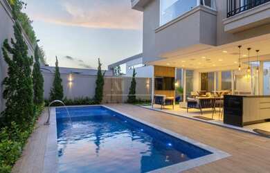 Imagem: A casa em condomínio possui 4 Dormitórios, 5 Banheiros, 4