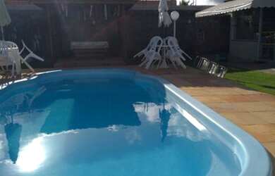 Imagem: A casa possui 4 Dormitórios, 4 Vagas na garagem e está localizado