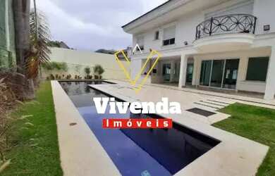 Imagem: A casa em condomínio possui 5 Dormitórios, 5 Banheiros, 1.200m²