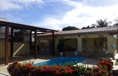 Imagem: A casa possui 5 Dormitórios, 3 Vagas na garagem e está localizado