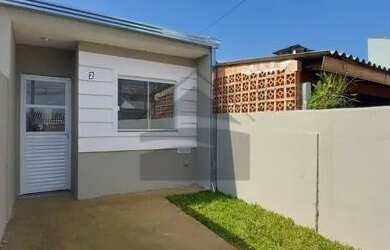 Imagem: A casa possui 2 Dormitórios, 1 Banheiro, 1 Vaga na garagem