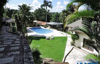 Imagem: A casa possui 4 Dormitórios, 5 Banheiros, 5 Vagas na garagem