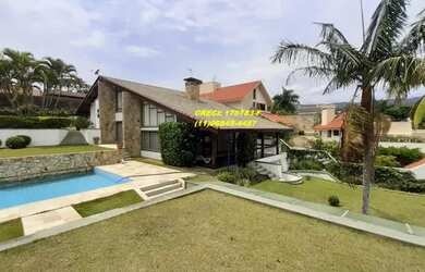 Imagem: A casa possui 4 Dormitórios, 5 Banheiros, 5 Vagas na garagem