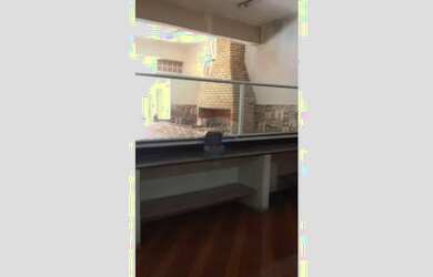 Imagem 3: Salão com churrasqueira pia e balcão