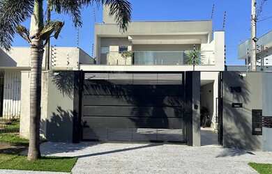 Imagem: A casa possui 3 Dormitórios, 5 Banheiros, 4 Vagas na garagem