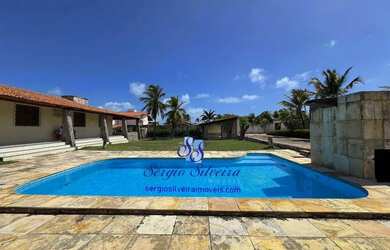 Imagem: A casa possui 4 Dormitórios, 4 Banheiros, 5 Vagas na garagem