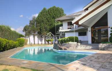 Imagem: A casa possui 5 Dormitórios, 5 Banheiros, 5 Vagas na garagem