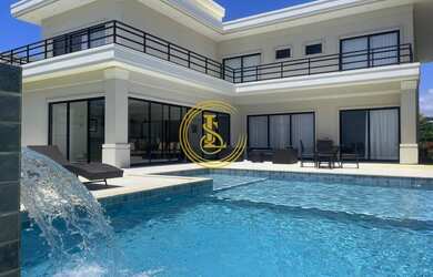 Imagem: A casa possui 5 Dormitórios, 5 Banheiros, 4 Vagas na garagem