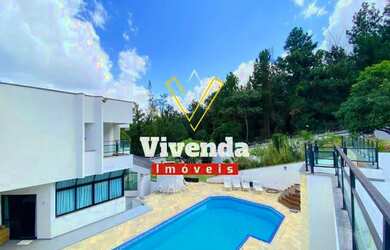 Imagem: A casa em condomínio possui 4 Dormitórios, 5 Banheiros, 5