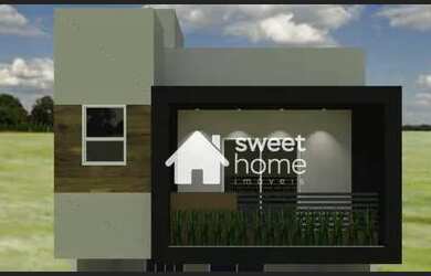 Imagem: A casa possui 3 Dormitórios, 2 Banheiros, 2 Vagas na garagem