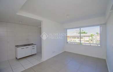 Imagem: O apartamento possui 1 Dormitório, 1 Banheiro, 1 Vaga na garagem