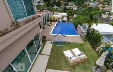 Imagem: A casa em condomínio e possui 5 Dormitórios, Suítes, 5 Banheiros