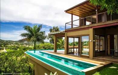 Imagem: A casa possui 5 Dormitórios, 5 Banheiros, 3 Vagas na garagem