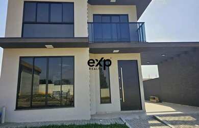 Imagem: A casa possui 3 Dormitórios, 2 Banheiros, 2 Vagas na garagem