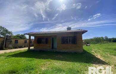 Imagem: A casa possui 3 Dormitórios, 1 Banheiro, 60m² de Área e