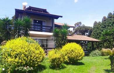 Imagem: A casa possui 3 Dormitórios, 3 Banheiros, 2 Vagas na garagem