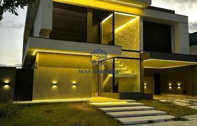 Imagem: A casa possui 4 Dormitórios, 5 Banheiros, 4 Vagas na garagem