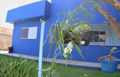 Imagem: A casa possui 3 Dormitórios, 4 Banheiros, 5 Vagas na garagem