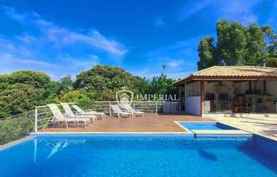 Imagem: A casa em condomínio possui 4 Dormitórios, 5 Banheiros, 5