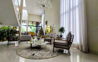 Imagem: A casa possui 4 Dormitórios, 4 Banheiros, 4 Vagas na garagem