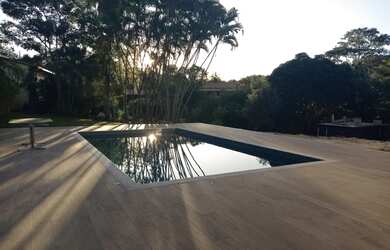 Imagem: A casa em condomínio possui 4 Dormitórios, 4 Banheiros, 5