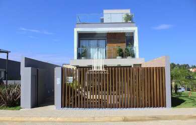 Imagem: A casa possui 3 Dormitórios, 5 Banheiros, 3 Vagas na garagem