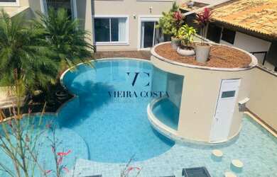 Imagem: A casa possui 5 Dormitórios, 5 Banheiros e 5 Vagas na garagem